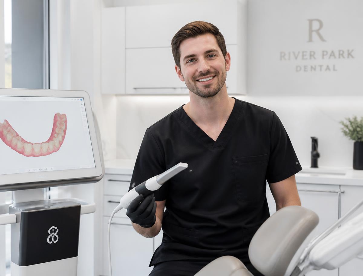 Dental professional holding an intraoral scanner used to make a digital 3D model of the teeth